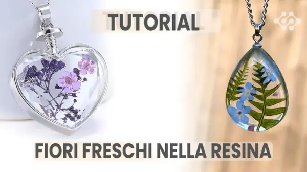 Ciondoli a forma di cuore e goccia con fiori freschi nella resina, perfetti per un tutorial creativo.